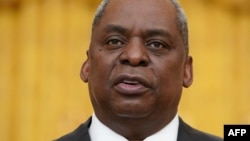 (FILES) In this file photo US Defense Secretary Lloyd Austin speaks during International Women's Day in the East Room of the White House in Washington, DC on March 8, 2021. - US Secretary of State Antony Blinken and Defense Secretary Lloyd Austin…