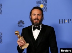 Casey Affleck holds the award for Best Performance by an Actor in a Motion Picture - Drama for his role in "Manchester By The Sea" during the 74th Annual Golden Globe Awards in Beverly Hills, CA, Jan. 8, 2017.