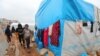 FILE - Children are seen at a displaced persons camp in Idlib province, Syria, Dec. 1, 2020.