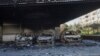 Burned-out cars remain in an open garage following the recent wave of violence between Syrian security forces and gunmen loyal to former President Bashar Assad, as well as subsequent sectarian attacks, Jableh, Syria, March 10, 2025.
