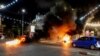 Sejumlah ban mobil dibakar sebagai aksi protes setelah seorang warga Palestina tewas dalam operasi militer Israel, di Jenin, Tepi Barat yang diduduki Israel, 3 Juli 2023. (Foto: REUTERS/Raneen Sawafta)