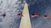 American flags fly below the Washington Monument. (AP Photo/Alex Brandon)