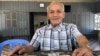 Bou Meng, an ex-prisoner at S-21, talked to VOA about his memories of the clothing he once wore while imprisoned and tortured at S-21. (T.Soksreinith/VOA Khmer)