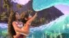 This image released by Disney shows the characters Moana, voiced by Auli'i Cravalho, holding Simea, voiced by Khaleesi Lambert-Tsuda, in a scene from "Moana 2."