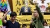 FILE - Student leaders chant slogans inside Taiwan's parliament, after a visit from Legislative Speaker Wang Jin-pyng and lawmakers from both the Nationalist Party (KMT) and opposition Democratic Progressive Party (DPP) in Taipei, Apr. 6, 2014.