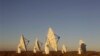 Radio telescopes like these near Carnarvon, South Africa are used to study radio signals from throughout the universe.