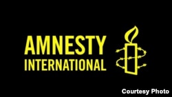 Logo organizacije Amnesti Internešnal