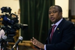 Zimbabwe's Finance Minister Mthuli Ncube delivers a speech to present his mid-term budget statement on Aug. 1, 2019, in Harare.