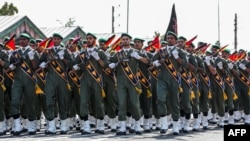 FILE - A handout photo from the Iranian presidency on Sept. 22, 2019, shows members of Iran's Islamic Revolutionary Guard Corps marching during an annual military parade.
