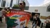 FILE - In this March 24, 2016 file photo, a protester holds a poster during a rally outside the Australian Embassy in Jakarta, Indonesia, as dozens of people show their support to East Timor in the dispute over oil and gas revenue-sharing between the two 