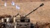 An Israeli army M109 155mm self-propelled howitzer is deployed at a position along the border with the Gaza Strip near Sderot in southern Israel on October 27, 2023 amid ongoing battles between Israel and the Palestinian Hamas movement.