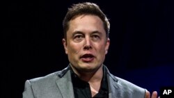 FILE - Elon Musk, CEO of Tesla Motors Inc., unveils the company’s newest products in Hawthorne, Calif., April 30, 2015. 