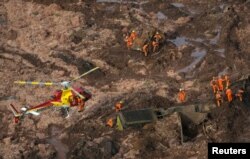 Rescue crew work in a tailings dam owned by Brazilian miner Vale SA that burst, in Brumadinho, Brazil, Jan. 25, 2019.