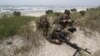 FILE - U.S. Marines take part in a landing operation during military Exercise Baltops 2018 at the Baltic Sea, about 340 kms (211 miles) west north of the capital Vilnius, Lithuania, June 4, 2018.