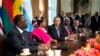 President Barack Obama speaks in the Cabinet Room of the White House Thursday, after a meeting with, from left, Senegal President Macky Sall; Malawi President Joyce Banda; Sierra Leone President Ernest Bai Koroma; and Cape Verde Prime Minister José Maria Pereira Neves. 