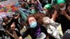 Women shout during a march ahead of International Women's Day in Quito, Ecuador, March 7, 2021. 