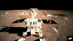 FILE - China's first moon rover 'Jade Rabbit' touch the lunar surface and leave deep traces on its loose soil.