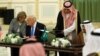 Saudi Arabia's King Salman bin Abdulaziz Al Saud (right) and U.S. President Donald Trump sign a joint security agreement at the Royal Court in Riyadh, Saudi Arabia, May 20, 2017.
