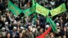 Iranians chant slogans as they march in support of the government near the Imam Khomeini grand mosque in the capital Tehran, Dec. 30, 2017.