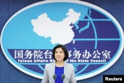 Zhu Fenglian, Juru bicara China untuk Kantor Urusan Pemerintah Taiwan, dalam konferensi pers di Beijing, 27 November 2019. (REUTERS/Stringer)