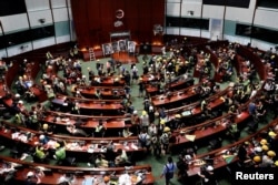 People are seen inside a chamber, after protesters broke into the Legislative Council building during the anniversary of Hong Kong's handover to China in Hong Kong, China July 1, 2019.