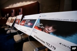 Facebook ads linked to a Russian effort to disrupt the American political process are displayed at a House Intelligence Committee hearing on Capitol Hill in Washington, Nov. 1, 2017.