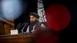 د طالبانو ترجمان د خپلې کابېنې دفاع کوي، ویلي یې دي چې مېرمنو ته به پکې وروسته نمایندګي ورکولی شي