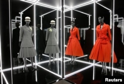 Creations on display during a photocall for the "Christian Dior: Designer of Dreams" exhibition at the Victoria & Albert (V&A) Museum in London, Jan. 30, 2019.