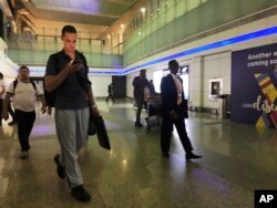 Mariners from the MT Front Altair arrive at Dubai International Airport in Dubai, United Arab Emirates, June 15, 2019, after spending two days in Iran.