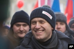 FILE - Russian opposition leader Alexei Navalny, attends a rally in memory of opposition leader Boris Nemtsov, in Moscow, Feb. 25, 2018.