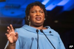 FILE - Then-Georgia Democratic gubernatorial candidate Stacey Abrams addresses supporters during an election night watch party in Atlanta, Nov. 6, 2018.