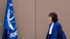FILE - Judge Tomoko Akane walks before delivering a verdict at the International Criminal Court in The Hague, Netherlands, Nov. 20, 2024.