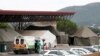 FILE - An ambulance is parked near tents erected at the parking lot of the Steve Biko Academic Hospital, amid a nationwide coronavirus disease (COVID-19) lockdown, in Pretoria, South Africa, Jan. 11, 2021. 