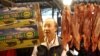 An official from the Taipei City Department of Health inspects a beef stall in a traditional market with reporters in Taipei March 22, 2012. 