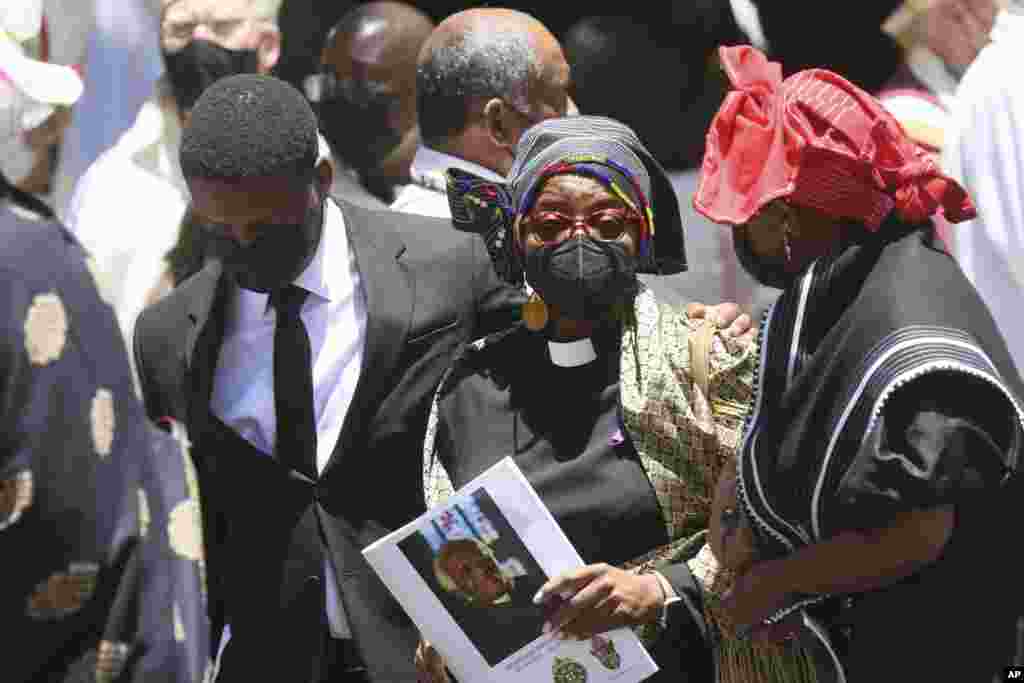 Tutu's family members are seen outside the cathedral at the end of the funeral service for Anglican Archbishop Emeritus Desmond Tutu at St. George's Cathedral in Cape Town, South Africa, Jan. 1, 2022.