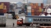 FILE - Containers are piled up at a terminal at the Jawaharlal Nehru Port Trust in Mumbai, India, June 29, 2017. India’s commerce ministry says it will not try to hold onto its preferential zero-tariffs status with the United States.