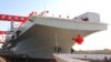 In this photo released by Xinhua News Agency, China's first Type 076 new-generation amphibious assault ship, the Sichuan, is seen in Shanghai, Dec 27, 2024. (Li Yun/Xinhua via AP)