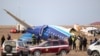 Petugas tanggap darurat bekerja di lokasi jatuhnya pesawat penumpang Azerbaijan Airlines di dekat kota Aktau, Kazakhstan barat pada 25 Desember 2024. 