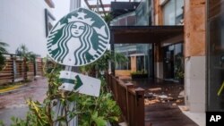 Foto Achiv: Yon afich kafe Starbucks. 