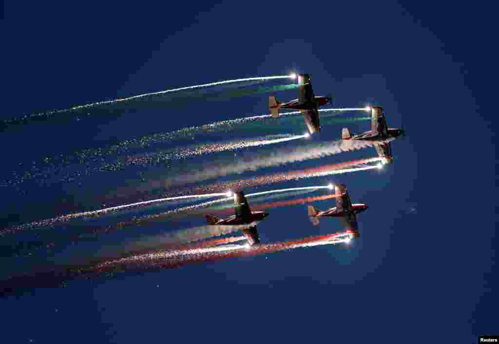The Pioneer Team, a civil aerobatic team from Italy, lets off pyrotechnics from their Pioneer 330 aircraft during the Malta International Airshow off SmartCity Malta, outside Valletta, Malta, Sept. 24, 2016.