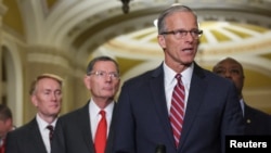 FILE - Republican U.S. Senator John Thune, who was elected to become the next Senate majority leader, speaks to reporters on Capitol Hill in Washington, Nov. 13, 2024.