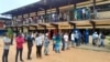 FILE - People wait in line for the opening of a polling office during the presidential election in Libreville, Gabon, Aug. 26, 2023. Soon after the election, longtime President Ali Bongo Ondimba was ousted by a coup.