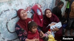FAAYILII - Manni barumsaa dahoo gohdatanii turan Israa'eliin haleellaamuu boda namoota boohaa turan, Magaala Gaazaa, Sadaasa 7, 2024.