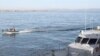 A Spanish Guardia Civil boat (L) sails near a rapid deployment boat belonging to the French patrol boat Arago involved in a survey operation from Almeria harbor as part of the "Indalo" illegal immigrants drill operation organized by the European Union's b