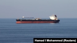 Oil tankers pass through the Strait of Hormuz