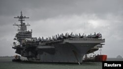 The USS George H.W. Bush aircraft carrier is seen anchored off Stokes Bay in the Solent, Britain, July 27, 2017. 