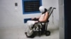 This frame grab from Australian Broadcasting Corporation's (ABC) Four Corners program broadcast in Australia on July 25, 2016 and released on July 26, 2016 allegedly shows a teenage boy hooded and strapped into a chair at a youth detention center in the Northern Territory city of Darwin.