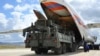 Military vehicles and equipment, parts of the S-400 air defense systems, are unloaded from a Russian transport aircraft, at Murted military airport in Ankara, Turkey, July 12, 2019. 