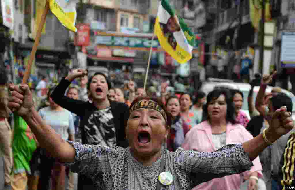 Supporters of the Gorkha People's Liberation Front (GJMM) take part in a rally during a strike demanding a new Indian state at Kalimpong town, some 75 km from Siliguri, India.