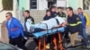 Paramedics transport student wounded during shooting Jan. 10, 2013 at San Joaquin Valley high school in Taft, Calif (Taft Midway Driller/Doug Keeler)